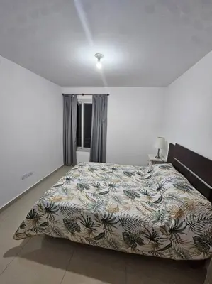 a bedroom with a large bed in a room at Departamento en Córdoba in Cordoba
