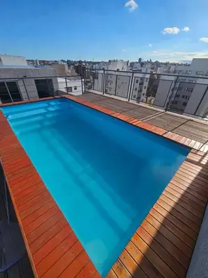 a large swimming pool on the roof of a building at Departamento en Córdoba in Cordoba