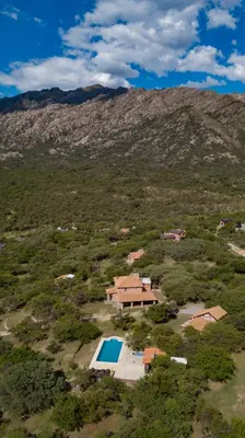 an aerial view of a house with a swimming pool at Cabañas San Miguel in Cortaderas