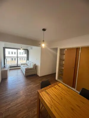 a living room with a couch and a table at Dpto p 3 en pleno Nva. Córdoba in Cordoba