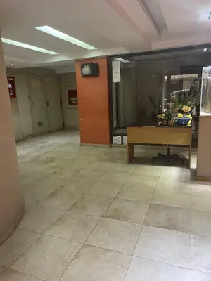 an empty lobby with a table in a room at Dpto p 3 en pleno Nva. Córdoba in Cordoba