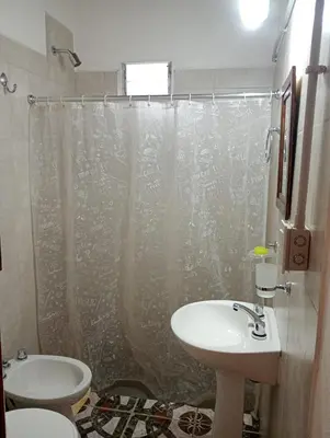 a bathroom with a sink and a toilet and a shower at Cheroga in Trapiche