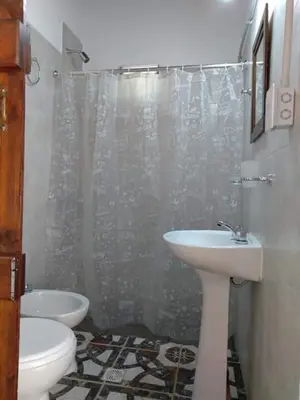 a bathroom with a sink and a toilet and a shower at Cheroga in Trapiche