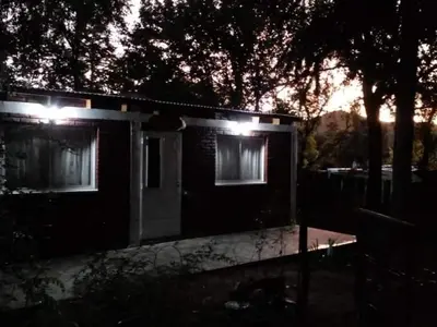 a house with two windows with lights on it at Cheroga in Trapiche
