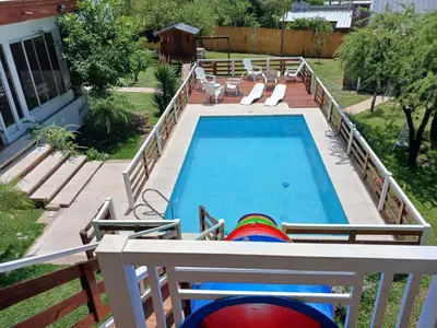 an overhead view of a swimming pool with chaise lounge chairs at Atardeceres del Valle in La Bolsa
