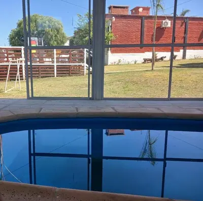 a view of a pool of water through a window at Atardeceres del Valle in La Bolsa