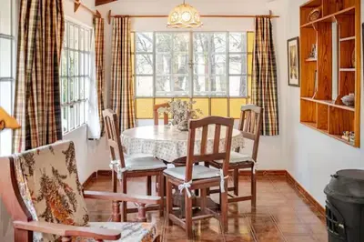 a dining room with a table and chairs at Hermosa Casa V. General Belgrano in Villa General Belgrano