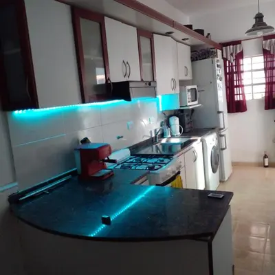 a kitchen with a counter with blue lights on it at DAS THOMY II in Cordoba