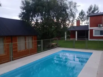 a swimming pool in front of a house at Shakty 