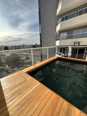 a swimming pool on the balcony of a building at Departamento c/ piscina climatizada privada, 4 habitaciones en el centro de Cordoba in Cordoba