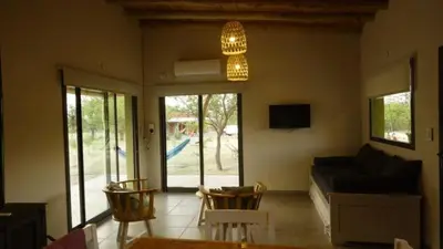 a living room with a couch and a table and chairs at las tacanas casa del alto in Nono