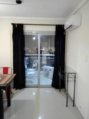 a living room with a sliding glass door at Dpto doña coca alto villasol gama in Cordoba