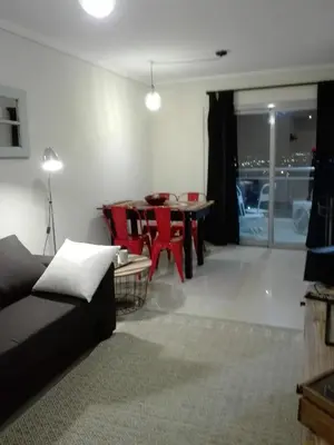 a living room with a couch and a table at Dpto doña coca alto villasol gama in Cordoba