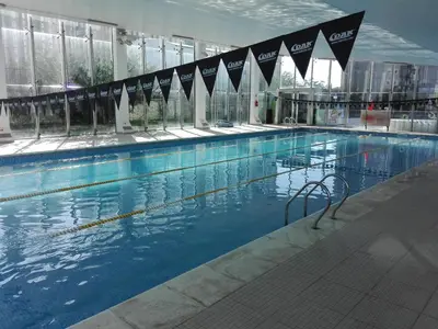 a large swimming pool in a building at Dpto doña coca alto villasol gama in Cordoba