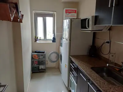 a small kitchen with a refrigerator and a sink at Dpto doña coca alto villasol gama in Cordoba