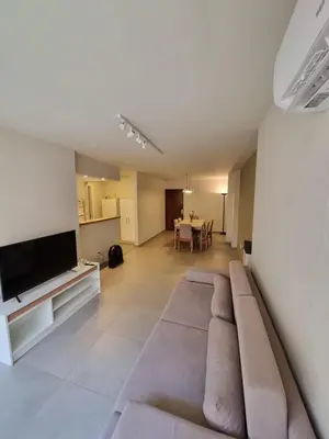 a living room with a couch and a flat screen tv at HERMOSO - CATEGORIA Departamento 90 m2 CENTRO con COCHERA opcional in Cordoba