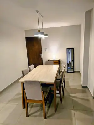 a dining room table and chairs in a room at HERMOSO - CATEGORIA Departamento 90 m2 CENTRO con COCHERA opcional in Cordoba