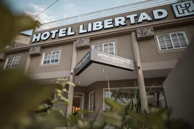 a hotel lichfield with a sign in front of it at Hotel Libertad in Villa Carlos Paz