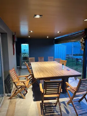 a dining room with a large wooden table and chairs at Reserva Tajamar in Alta Gracia