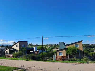 a group of houses on the side of a road at La Casita Estanciera in Estancia Vieja