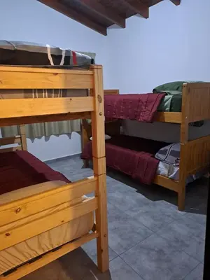 a group of bunk beds in a room at La Casita Estanciera in Estancia Vieja