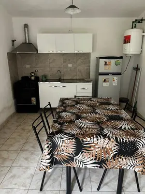 a kitchen with a table with a patterned table sidx sidx sidx sidx at Casa de verano Marcos Lopez in Villa Cura Brochero