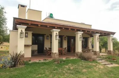 a house with a porch and a patio at CASA DE CAMPO COLIBRI EN LA MATILDE in San Javier