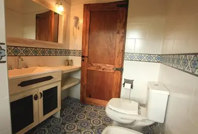 a bathroom with a toilet and a sink at CASA DE CAMPO COLIBRI EN LA MATILDE in San Javier
