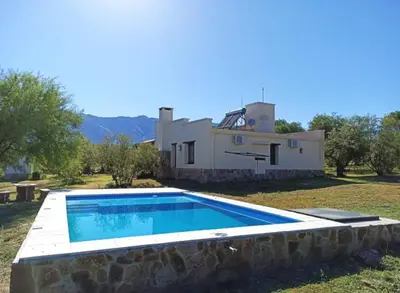 a swimming pool in front of a house at CASA DE CAMPO COLIBRI EN LA MATILDE in San Javier