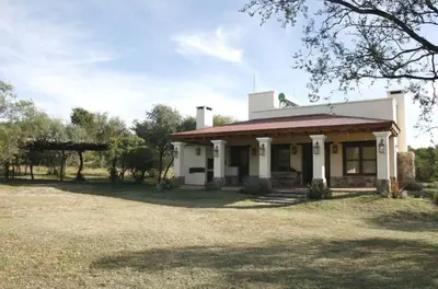 a white house with a red roof at CASA DE CAMPO COLIBRI EN LA MATILDE in San Javier