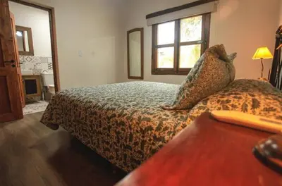 a hotel room with a bed and a window at CASA DE CAMPO COLIBRI EN LA MATILDE in San Javier