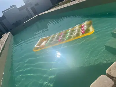 a pool of water with a paddle in it at Chalet Mariam in Villa Carlos Paz
