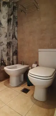 a bathroom with a toilet and a sink at Espacio C Montevideo con estacionamiento in Cordoba