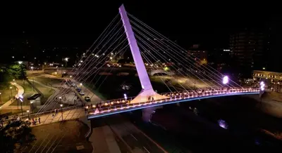 a large bridge with lights on it at night at Casa Nómada - Centro in Cordoba