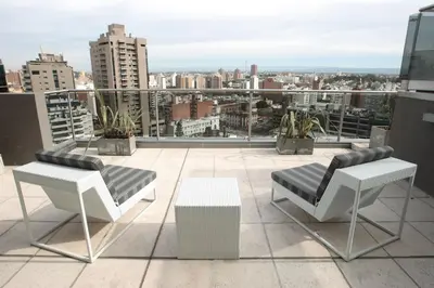 a balcony with a view of a city at Yrigoyen 111 Hotel in Cordoba
