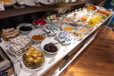 a buffet line with many different types of food at Yrigoyen 111 Hotel in Cordoba