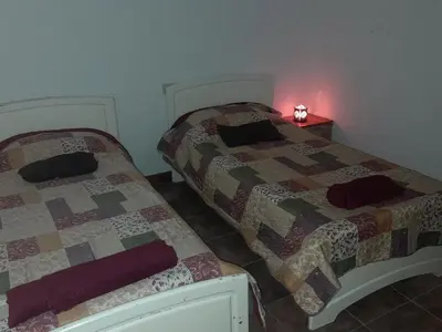 two beds sitting next to each other in a room at Dpto del Sur in San Roque