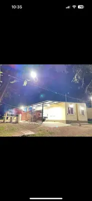 a building with a street light on top of it at Cabaña Clarita La Florida in La Florida