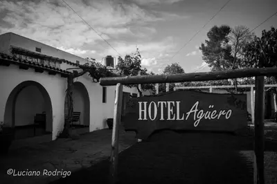 a sign that says hotel albuquerque in front of a building at Hotel Agüero in Mina Clavero