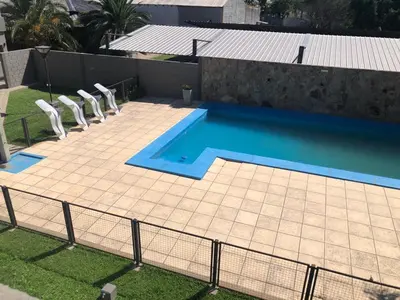 an overhead view of a swimming pool with chairs next to it at Hotel Rincon Del Este in General Deheza