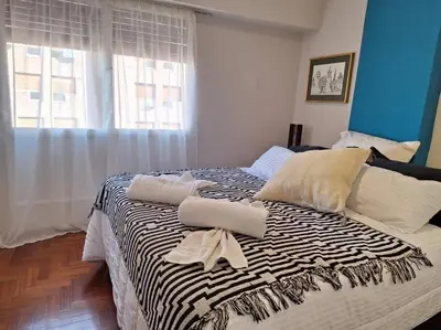 a bed with two pillows on it in a bedroom at La mejor ubicación turística del centro Córdoba in Cordoba