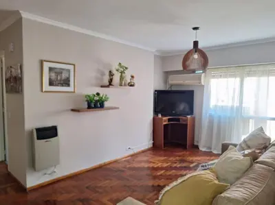 a living room with a couch and a flat screen tv at La mejor ubicación turística del centro Córdoba in Cordoba