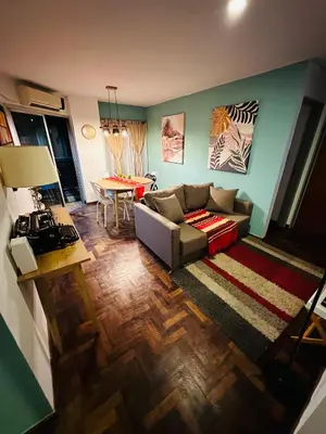 a living room with a couch and a table at Refugio Urbano in Cordoba