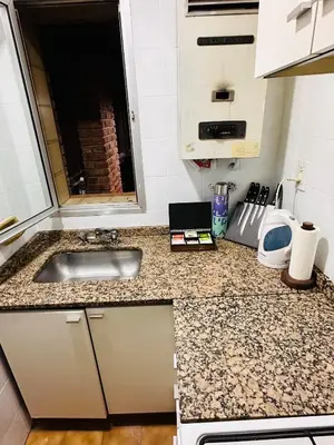a kitchen with a sink and a counter top at Refugio Urbano in Cordoba