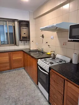a kitchen with a stove and a counter top at Departamento -Balcarce- Nueva Córdoba, ByApartcba in Cordoba