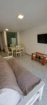 a living room with a bed and a table at Departamento -Balcarce- Nueva Córdoba, ByApartcba in Cordoba