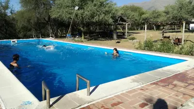 a group of people in a swimming pool at White Field Houses and Spa in Villa de Las Rosas