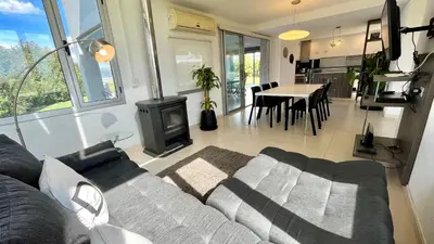 a living room with a couch and a table at Casa Calma Puerto del Aguila in Potrero de Garay
