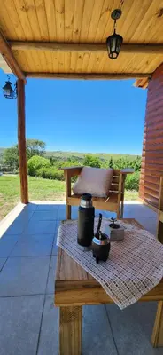 a picnic table under a wooden roof on a patio at Cabañas Potrero de Marquez Paraiso Adult only in Potrero de Garay
