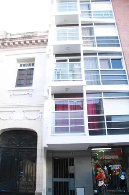 a tall white building with lots of windows at Depto En El Centro - Dean Funes in Cordoba
